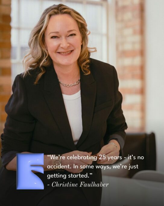 Smiling woman in a black blazer seated indoors, with a blue decorative shape and a quoted line about celebrating 25 years.